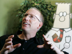 FILE - Scott Adams, creator of the comic strip Dilbert, talks about his work at his studio in Dublin, Calif., on Oct. 26, 2006. Adams experienced possibly the biggest repercussion of his recent comments about race when distributor Andrews McMeel Universal announced Sunday, Feb. 26 it would no longer work with the cartoonist. In an episode of his YouTube show last week, Adams described people who are Black as members of “a hate group” from which white people should “get away.” Various media publishers across