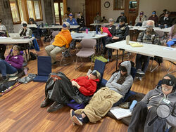 FILE - Psilocybin facilitator students sit with eye masks on while listening to music during an experiential activity at a training session run by InnerTrek near Damascus, Ore., on Dec. 2, 2022. The first students graduate on Friday, March 10, 2023, marking a major step in Oregon's pioneering role in establishing legal psilocybin therapeutic sessions. The students were trained in how to accompany patients tripping on psilocybin. (AP Photo/Andrew Selsky,File)