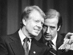 FILE - In this Feb. 20, 1978, file photo, President Jimmy Carter listens to Sen. Joseph R. Biden, D-Del., as they wait to speak at fund raising reception at Padua Academy in Wilmington, Del. President Joe Biden says he plans to deliver the eulogy at the funeral of former President Jimmy Carter, who remains under hospice care at his home in south Georgia. (AP Photo/Barry Thumma, File)