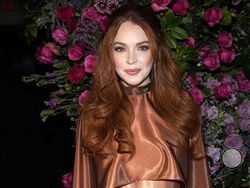 FILE - Lindsay Lohan appears the Christian Siriano Fall/Winter 2023 fashion show in New York on Feb. 9, 2023. Lohan is expecting her first child. The “Mean Girls” star announced her pregnancy on Instagram on Tuesday. (Photo by Charles Sykes/Invision/AP, File)