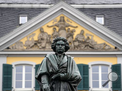 A statue of world famous composer Ludwig van Beethoven is stands in the city center of his birthplace Bonn, Germany, on Tuesday, March 21, 2023. An international team of researchers led by Cambridge University have pulled Beethoven's genome from locks of his hair to look for clues about his many health problems. (AP Photo/Martin Meissner)