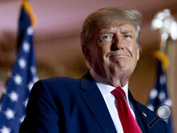 FILE - Former President Donald Trump announces he is running for president for the third time as he smiles while speaking at Mar-a-Lago in Palm Beach, Fla., Nov. 15, 2022. A lawyer for Trump said Thursday, March 30, 2023, that he has been told that the former president has been indicted in New York on charges involving payments made during the 2016 presidential campaign to silence claims of an extramarital sexual encounter. (AP Photo/Andrew Harnik, File)