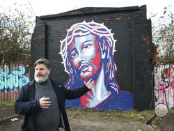 onny Clark, program manager for public theology at Corrmeela, an organisation that has worked for decades toward reconciliation in Northern Ireland, visits the peace walls in west Belfast, Northern Ireland, Saturday, Jan. 28, 2023. Twenty-five years ago, the Good Friday Agreement halted much of the violence of Northern Ireland’s Troubles. Today, grassroots faith leaders are trying to build on that opportunity. They're working toward reconciliation in a land where religion was often part of the problem. (AP 