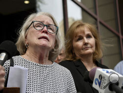Jean Hargadon Wehner speaks about the release of the redacted report on child sexual abuse in the Catholic Archdiocese of Baltimore by the Maryland Attorney General's Office on Wednesday, April 6, 2023, in Baltimore. Standing next to her is Teresa Lancaster. (Kim Hairston/The Baltimore Sun via AP)