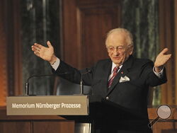 FILE - Benjamin Ferencz, Romanian-born American lawyer and chief prosecutor of the Nuremberg war crimes trials, speaks during an opening ceremony for the exhibition commemorating the Nuremberg war crimes trials in Nuremberg, Germany, Sunday, Nov. 21, 2010. Ferencz, the last living prosecutor from the Nuremberg trials, who tried Nazis for genocidal war crimes and was one of the first outside witnesses to document the atrocities of Nazi labor and concentration camps as a U.S. Army soldier, died Friday evening