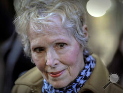 FILE - E. Jean Carroll talks to reporters outside a courthouse in New York, March 4, 2020. Federal Judge Lewis A. Kaplan issued an order Monday, April 10, 2023, directing parties to notify him if Trump plans to attend a New York trial later in the month resulting from Carroll's claims that he raped her in a department store dressing room in the 1990s. (AP Photo/Seth Wenig, File)