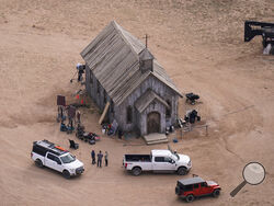 FILE - This aerial photo shows the movie set of "Rust" at Bonanza Creek Ranch in Santa Fe, N.M., on Saturday, Oct. 23, 2021. Prosecutors in New Mexico plan to drop an involuntary manslaughter charge against Alec Baldwin in the fatal 2021 shooting of a cinematographer on the set of the Western film “Rust.” Baldwin’s attorneys said in a statement Thursday that they are pleased with the decision to dismiss the case. (AP Photo/Jae C. Hong, File)