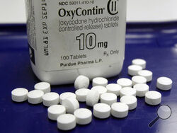More than a year after OxyContin maker Purdue Pharma reached a tentative settlement over the toll of opioids that was accepted nearly universally by the groups suing the company — including thousands of people injured by the drug — money is still not rolling out. Parties waiting to finalize the deal are waiting for a court to rule on the legality of a key detail: whether members of the Sackler family who own the company can be protected from lawsuits over OxyContin in exchange for handing over up to $6 bil