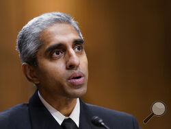 FILE - Surgeon General Dr. Vivek Murthy testifies before the Senate Finance Committee on Capitol Hill in Washington, on Feb. 8, 2022, on youth mental health care. Widespread loneliness in the U.S. is posing health risks as deadly as smoking a dozen cigarettes daily, costing the health industry billions of dollars annually, the U.S. surgeon general said Tuesday in declaring the latest public health epidemic. About half of U.S. adults say they’ve experienced loneliness, Murthy said in a new, 81-page report fr