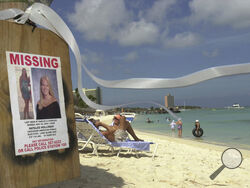 FILE - A sign of Natalee Holloway, an Alabama high school graduate who disappeared while on a graduation trip to Aruba, is seen on Palm Beach, in front of her hotel in Aruba, Friday, June 10, 2005, as a ribbon in her memory blows in the breeze. The government of Peru on Wednesday, May 10, 2023, issued an executive order allowing the temporary extradition to the United States of Joran van der Sloot, the prime suspect in the unsolved 2005 disappearance of Natalee Holloway. (AP Photo/Leslie Mazoch, File)