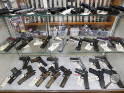FILE - Semi-automatic handguns are displayed at shop in New Castle, Pa., March 25, 2020. A U.S. judge's ruling Wednesday, May 11, 2023, striking down a federal law that bans licensed federal firearms dealers from selling handguns to young adults under 21 is the latest example of how a landmark Supreme Court decision is transforming the legal landscape around firearms. (AP Photo/Keith Srakocic, File)