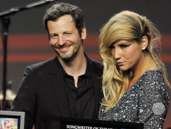FILE - Songwriter Lukasz "Dr. Luke" Gottwalk, left, poses with singer Kesha after receiving his award at the 28th Annual ASCAP Pop Music Awards in Los Angeles, April 27, 2011. Pop star Kesha and producer Dr. Luke have settled nearly a decade of suits and countersuits over her accusation that he drugged and raped her and his claim that she made it up and defamed him. Both announced it on Instagram on Thursday, June 22, 2023, and issued statements. (AP Photo/Chris Pizzello, File)