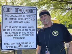 Deptford Little League President Don Bozzuffi poses at the Deptford, N.J. Little League complex, May 10, 2023. Baseball is steeped in the tradition of fans wanting to jeer the umpire. One Little League in New Jersey is taking a more hands-on approach. The fans could become the umpires if they won't follow league rules on sportsmanship. (AP Photo/Dan Gelston)