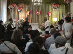 CAPTION CORRECTION CORRECTS NAME SPELLING: People attend during the Anadith Danay Reyes Alvarez's wake at R.G. Ortiz Funeral Home on Friday, June 16, 2023, in New York. U.S. Customs and Border Protection has reassigned its chief medical officer after the in-custody death of the 8-year-old whose mother's pleas for an ambulance were ignored despite her daughter's chronic heart condition, rare blood disorder, high fever and other ailments, authorities said Thursday, June 15, 2023. (AP Photo/Jeenah Moon)