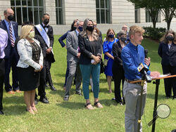 FILE - Dylan Brandt speaks at a news conference outside the federal courthouse in Little Rock, Ark., July 21, 2021. Brandt, a teenager, is among several transgender youth and families who are plaintiffs challenging a state law banning gender confirming care for trans minors. A federal judge struck down Arkansas' first-in-the-nation ban on gender-affirming care for children as unconstitutional Tuesday, June 20, 2023. (AP Photo/Andrew DeMillo, File)