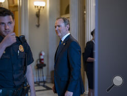 Rep. Adam Schiff, D-Calif., center, one of the most outspoken critics of former President Donald Trump, stands outside the chamber after the Republican-controlled House voted along party lines to censure him for comments he made several years ago about investigations into Trump's ties to Russia, at the Capitol in Washington, Wednesday, June 21, 2023. (AP Photo/J. Scott Applewhite)