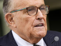 FILE - Rudy Giuliani speaks with reporters as he departs the federal courthouse, May 19, 2023, in Washington. Giuliani, who as a member of Donald Trump's legal team sought to overturn 2020 presidential election results in battleground states, was interviewed recently by investigators with the Justice Department special counsel's office, according to a person familiar with the matter. (AP Photo/Patrick Semansky, File)