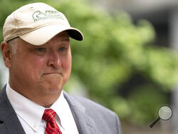 Former Ohio House Speaker Larry Householder walks to the Potter Stewart Federal Courthouse for his sentencing hearing, Thursday, June 29, 2023, in Cincinnati. Householder was sentenced to 20 years in prison, plus one year of probation, for his role in the largest corruption scandal in state history. (Albert Cesare/The Cincinnati Enquirer via AP)