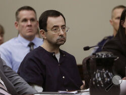 FILE -Larry Nassar sits during his sentencing hearing Wednesday, Jan. 24, 2018, in Lansing, Mich. Nassar, who was convicted of sexually abusing female gymnasts including Olympic medalists, was stabbed multiple times during an altercation with another inmate at a federal prison in Florida on Sunday, July 9, 2023. (AP Photo/Carlos Osorio, File)