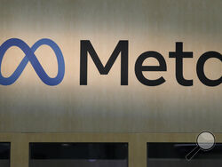 FILE - A Meta sign is displayed at the company's booth at the Game Developers Conference 2023 in San Francisco, March 22, 2023. A group of congressional Democrats reported Wednesday, July 12, that three large tax preparation firms sent "extraordinarily sensitive" information on tens of millions of taxpayers to Facebook parent company Meta over the course of at least two years.(AP Photo/Jeff Chiu, File)