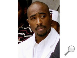 FILE - Rapper Tupac Shakur attends a voter registration event in South Central Los Angeles, Aug. 15, 1996. Authorities in Nevada confirmed Tuesday, July 18, 2023, that they served a search warrant this week in connection with the long-unsolved killing of the late rapper Shakur. (AP Photo/Frank Wiese, File)