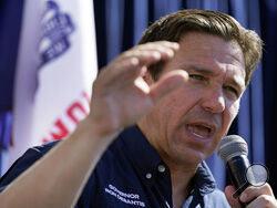 Republican presidential candidate Florida Gov. Ron DeSantis speaks during a Fair-Side Chat with Iowa Gov. Kim Reynolds at the Iowa State Fair, Aug. 12, 2023, in Des Moines, Iowa. He says he won't sign the pledge required to participate, but former President Donald Trump's Republican rivals are actively preparing as if he will be on stage for the GOP's first presidential debate next week.(AP Photo/Jeff Roberson)