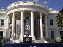 FILE - President Joe Biden speaks about the Inflation Reduction Act of 2022 during a ceremony on the South Lawn of the White House in Washington, Sept. 13, 2022. It's a once-in-a-generation undertaking, thanks to three big bills approved by Congress last session. They're now coming online. Biden calls it "Bidenomics." Republicans criticize it as big government overreach. Taken together, the estimated $2 trillion is a centerpiece of Biden's re-election effort. (AP Photo/Andrew Harnik, File)