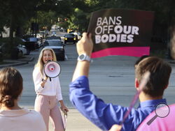 Democratic South Carolina Rep. Beth Bernstein leads chants at an abortion rights rally in Columbia, S.C., on Wednesday, Aug. 23, 2023. The South Carolina Supreme Court ruled Wednesday to uphold a law banning most abortions except in the earliest weeks of pregnancy. (AP Photo/James Pollard)