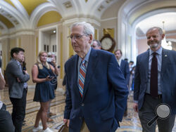 Senate Minority Leader Mitch McConnell, R-Ky., enters the chamber as he returns to work at the Capitol in Washington, Tuesday, Sept. 5, 2023. Questions have mounted over the long-serving Republican leader's health since McConnell froze up last week during a press conference in Kentucky, unable to respond to a question. It was the second such episode in a matter of weeks. (AP Photo/J. Scott Applewhite)