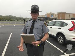 State police spokesman Trooper David Beohm addresses the media in Morgantown Pa. after the capture of nine escapees from the nearby Abraxas Academy juvenile facility Monday, Sept. 18 2023. (Steven Henshaw/Reading Eagle via AP)