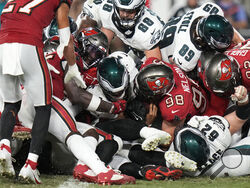 Philadelphia Eagles' Jalen Hurts, center, scores a touchdown during the second half of an NFL football game against the Tampa Bay Buccaneers, Monday, Sept. 25, 2023, in Tampa, Fla. (AP Photo/Chris O'Meara)