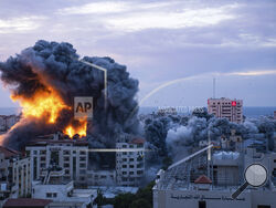 Fire and smoke rises following an Israeli airstrike, in Gaza City, Saturday, Oct. 7, 2023. The militant Hamas rulers of the Gaza Strip carried out an unprecedented, multi-front attack on Israel at daybreak Saturday, firing thousands of rockets as dozens of Hamas fighters infiltrated the heavily fortified border in several locations by air, land, and sea, killing dozens and stunning the country. Palestinian health officials reported scores of deaths from Israeli airstrikes in Gaza. (AP Photo/Fatima Shbair)