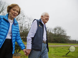 FILE - In this Feb. 8, 2017, file photo former President Jimmy Carter, right, and his wife Rosalynn arrive for a ribbon cutting ceremony for a solar panel project on farmland he owns in their hometown of Plains, Ga Jimmy and Rosalynn Carter have been best friends and life mates for nearly 80 years. Now with the former first lady's death at age 96, the former president must adjust to life without the woman who he credits as his equal partner in everything he accomplished in politics and as a global humanitar