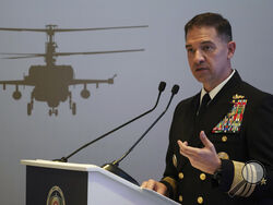 FILE - U.S. Navy Vice Adm. Brad Cooper, who heads the Navy's Bahrain-based 5th Fleet, speaks at an event at the International Defense Exhibition and Conference in Abu Dhabi, United Arab Emirates, Feb. 21, 2023. The top commander of U.S. naval forces in the Middle East says Yemen’s Houthi rebels are showing no signs of ending their “reckless” attacks on commercial ships in the Red Sea. But Vice Adm. Brad Cooper said in an Associated Press interview on Saturday that more nations are joining the international 