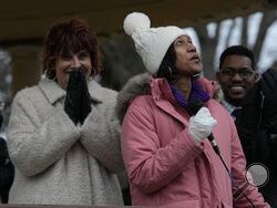 Brittany Watts, center, speaks to a rally of supporters, Thursday, Jan. 11, 2024, in Warren, Ohio. At left is her attorney, Traci Timko. A grand jury on Thursday decided that Watts, who was facing criminal charges for her handling of a home miscarriage, will not be charged. (AP Photo/Sue Ogrocki)