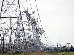 (AP Photo/David J. Phillip) Down power lines are shown in the aftermath of a severe thunderstorm Friday in Cypress, Texas, near Houston.