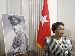 AP Photo/Rod Lamkey, Jr. Joann Woodson stands near a portrait of her husband, U.S. Army Staff Sgt. Waverly Woodson Jr., before a ceremony to posthumously award him the Distinguished Service Cross.