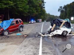 This Saturday, Aug. 31, 2013 photo shows the wreckage of two cars which collided on U.S. Route 219 in Hamlin Township, Pa. Police said the driver of the Jeep Liberty, left, crossed into oncoming traffic on a rural northwestern Pennsylvania highway and smashed head-on into the vehicle at right, killing six people, including two children. (AP Photo/The Bradford Era, Jay Bradish)