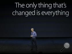 In this Wednesday, Sept. 9, 2015, file photo, Apple CEO Tim Cook discusses the new iPhone 6s and iPhone 6s Plus during the Apple event at the Bill Graham Civic Auditorium in San Francisco. (AP Photo/Eric Risberg, File)