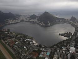 This July 27, 2015 aerial photo shows the Rodrigo de Freitas Lake in Rio de Janeiro, Brazil. An Associated Press analysis of water quality found dangerously high levels of viruses and bacteria from human sewage in Olympic and Paralympic venues. (AP Photo/Leo Correa)