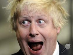 Mayor of London and prospective Conservative candidate for Uxbridge and South Ruislip, Boris Johnson reacts after winning the seat during the general election count at Brunel University in London Friday, May 8, 2015. (Andrew Matthews/PA via AP)