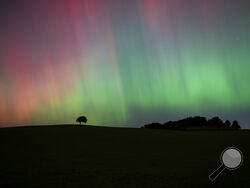 The Northern Lights, also known as the Aurora Borealis, are seen in the sky near Knaresborough, England, Friday, Oct. 11, 2024. (Andrew Hawkes via AP)