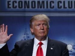 Republican presidential candidate Donald Trump waves after delivering an economic policy speech to the Detroit Economic Club, Monday, Aug. 8, 2016, in Detroit. (AP Photo/Evan Vucci)