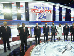 Republican presidential candidates, from left, former Arkansas Gov. Asa Hutchinson, former New Jersey Gov. Chris Christie, former Vice President Mike Pence, Florida Gov. Ron DeSantis, businessman Vivek Ramaswamy, former U.N. Ambassador Nikki Haley, Sen. Tim Scott, R-S.C., and North Dakota Gov. Doug Burgum stand on stage before a Republican presidential primary debate hosted by FOX News Channel Wednesday, Aug. 23, 2023, in Milwaukee. (AP Photo/Morry Gash)