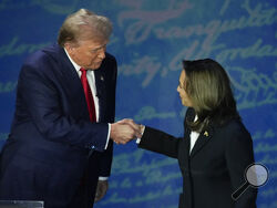 Republican presidential nominee former President Donald Trump and Democratic presidential nominee Vice President Kamala Harris shake hands before the start of an ABC News presidential debate at the National Constitution Center, Tuesday, Sept. 10, 2024, in Philadelphia. (AP Photo/Alex Brandon)