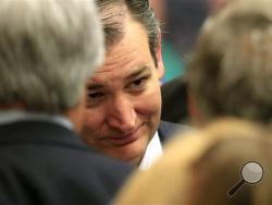 Republican presidential candidate, Sen. Ted Cruz, R-Texas, listens to a supporters at a caucus site, Saturday, March 5, 2016, in Wichita, Kan., (AP Photo/Orlin Wagner)