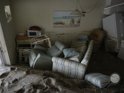 Several feet of sand fills a condo following the passage of Hurricane Milton, at YCA Vacation Rental in Venice, Fla., Friday, Oct. 11, 2024. (AP Photo/Rebecca Blackwell)