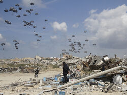Humanitarian aid is airdropped to Palestinians over Gaza City, Gaza Strip, Monday, March 25, 2024. (AP Photo/Mahmoud Essa)
