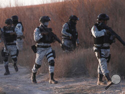 Mexican National Guard members patrol along the Mexico-US border in Ciudad Juarez, Wednesday, Feb. 5, 2025. (AP Photo/Christian Chavez)