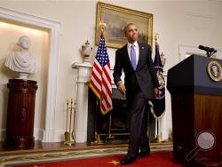 President Barack Obama leaves the podium after speaking about the release of Americans by Iran, Sunday, Jan. 17, 2016, in the Cabinet Room of the White House in Washington. (AP Photo/Jacquelyn Martin)